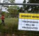 A man walks inside the fenced off area on the Euston Road side of Sydney Park.