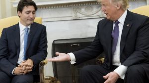 President Donald Trump, right, extends his hand to Justin Trudeau, Canada's prime minister, during a meeting in the Oval ...