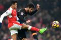 Hull's Andrea Ranocchia and Arsenal's match-winner Alexis Sanchez compete for the ball.