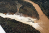 Aerial of water coursing from the dam, into Lake Oroville