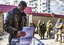 Russian rebel commander with the nom de guerre Givi casts his ballot during supreme council and presidential elections on the front line near Donetsk airport in the city of Donetsk, eastern Ukraine.