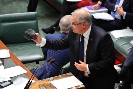 Scott Morrison holds a lump of coal in Parliament