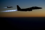 Two U.S. Air Force F-15E Strike Eagle aircraft fly over northern Iraq Sept. 23, 2014, after conducting airstrikes in Syria. The aircraft were part of a large coalition strike package that was the first to strike Islamic State of Iraq and the Levant (ISIL) targets in Syria. President Barack Obama authorized humanitarian aid deliveries to Iraq as well as targeted airstrikes to protect U.S. personnel from extremists known as ISIL. U.S. Central Command directed the operations. (DoD photo by Senior Airman Matthew Bruch, U.S. Air Force/Released)