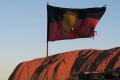 Uluru with Aboriginal flag flying