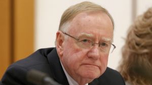 Senator Ian Macdonald listens to response from Solicitor-General Justin Gleeson SC during a public hearing before the ...