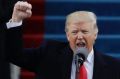 President Donald Trump pumps his fist after delivering his inaugural address.