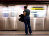 A commuter waits for a subway in Manhattan, New York.