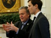 Trump's chief strategist Steve Bannon and senior adviser Jared Kushner speak in the White House, February 3, 2017.