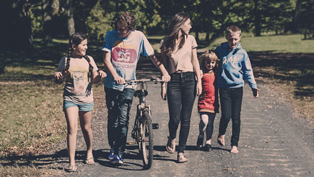 happy children of different ages walking along