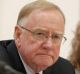 Senator Ian Macdonald listens to response from Solicitor-General Justin Gleeson SC during a public hearing before the ...