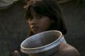 A girl carries a water jug in Kutapalong Rohingya refugee camp in Cox's Bazar, Bangladesh. 