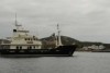 A boat anchored in a harbour.