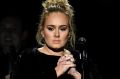 Technical issues didn't slow the winning pace for Adele at the Grammys where she won five awards, including album and ...