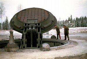 Russian high ranking military officials, look into an opened silo of a Russian intercontinental ballistic Topol-M missile somewhere at undisclosed location in Russia in this 2001 photo. Russia's Defense Minister Sergei Ivanov said in a speech before lawmakers that the plan envisages the deployment of the total of 34 new silo-based Topol-M missiles and their control units, as well as another 50 such missiles mounted on mobile launchers through 2015; Russia so far has deployed more than 40 silo-based Topol-Ms. 