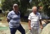 Andrew Nye and John Brierley, commercial cultural fisherman based in Moruya, check out their nets laid out on the ground.