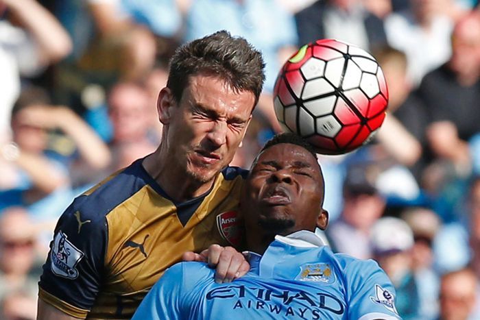 Arsenal's Laurent Koscielny goes for a header with Manchester City's Kelechi Iheanacho in May 2016.