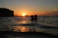 Sydney swelters through another night, as swimmers hit the beach just after 6am.