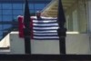 Still from a video showing a man protesting at the Indonesian consulate in Melbourne. He is holding a West Papua flag.