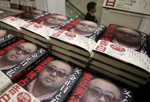 Copies of a new book on the eldest son of North Korea's late leader Kim Jong Il by Tokyo-based journalist Yoji Gomi are sold at a book store in Tokyo as it goes on sale Wednesday, Jan. 18, 2012.