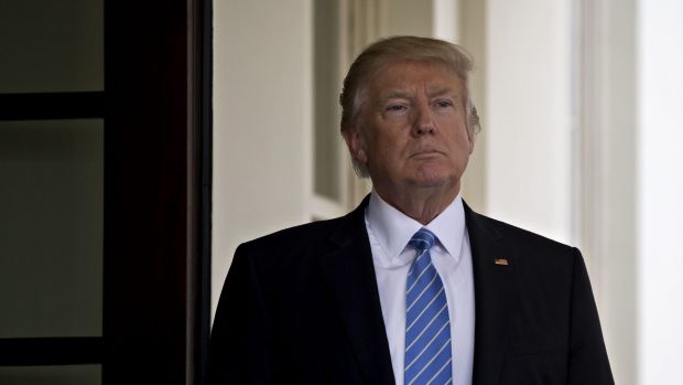 US President Donald Trump stands outside the West Wing of the White House as Israeli PM Benjamin Netanyahu, not ...