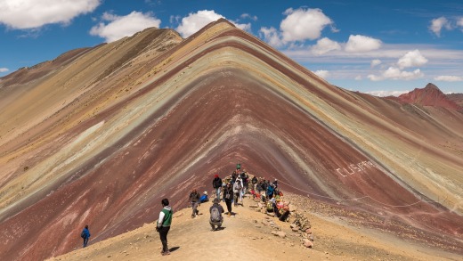Vinicunca Mountain (Rainbow Mountain) Peruvian Andes. The climb to get here is a challenge but well worth it to stand ...
