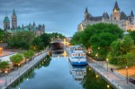 Parliament Hill along the banks of the Rideau Canal in Ottawa Ontario.