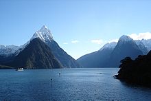 Blue water against a backdrop of snow-capped mountains