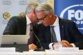 FFA Chairman Steven Lowy confers with CEO David Gallop.