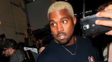 Kanye West (and his new bleached blonde 'do) leaves the Yeezy show fashion during New York Fashion Week.