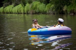 Armada of inflatable boats set sale along the Yarra River in Hawthorn.