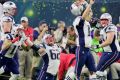 Celebration: Tom Brady of the New England Patriots reacts after stealing the Super Bowl in overtime.