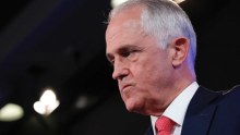 Prime Minister Malcolm Turnbull looks agitated and angry.