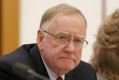 Senator Ian Macdonald listens to response from Solicitor-General Justin Gleeson SC during a public hearing before the ...