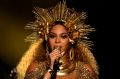 In a display of regal brilliance, a heavily pregnant Beyonce performs at the Grammys.