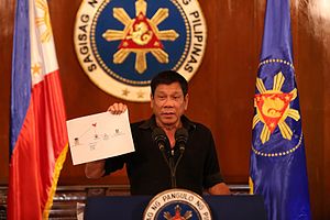 Rodrigo Duterte showing diagram of drug trade network 1 7.7.16.jpg