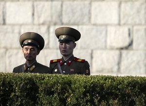 North Korean soldiers watch a parade in Pyongyang, North Korea, Saturday, Oct. 10, 2015.