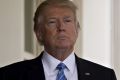 US President Donald Trump stands outside the West Wing of the White House as Israeli PM Benjamin Netanyahu, not ...