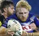 SYDNEY, AUSTRALIA - FEBRUARY 11: James Graham of the Bulldogs is tackled during the NRL Trial match between the ...