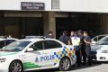 Police officers wait at the forensic department entrance at a hospital in Putrajaya, Malaysia, where Kim Jong-nam's body ...