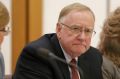 Senator Ian Macdonald listens to response from Solicitor-General Justin Gleeson SC during a public hearing before the ...