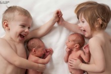 Twins Nico and Siena cuddle their newborn baby sisters - also twins!