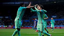 VITORIA-GASTEIZ, SPAIN - FEBRUARY 11:  Luis Suarez (L) of FC Barcelona celebrates scoring their opening goal with ...