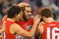 Advantage: Lance Franklin and team mates celebrate a goal.