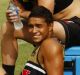 Three into two: Penrith young guns Nathan Cleary, Bryce Cartwright and Te Maire Martin relax after a training session.