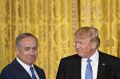 US President Donald Trump, right, looks towards Benjamin Netanyahu, Israel's prime minister, during a news conference in ...