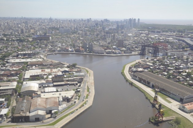 A view of Buenos Aires from the point where the Riachuelo flows into the Rio de la Plata. To the left can be seen the famous Boca Juniors stadium. Chronicles from 200 years ago were already talking about the pollution in the river. Credit: Courtesy of FARN