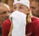 Denis Shapovalov of Canada reacts to hitting chair umpire Arnaud Gabas in the eye.