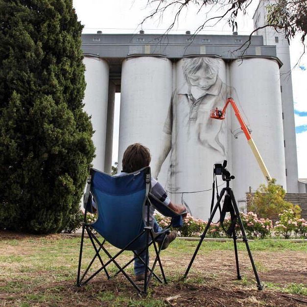 Watching paint dry has become Coonalpyn's most popular pastime. 
This week, thousands have stopped by to catch a glimpse of renowned artist Guido van Helten working his magic on the town's towering grain silos.

Retiree Fred Deeks plans on watching Guido work "until the last brushstroke". (📸 by Kate Hill)

#coonalpyn #southaustralia #sa #silo #guidovanhelten #art #mural #australia