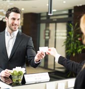 Image of customer and receptionist at a hotel