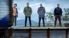 Ewan McGregor, Robert Carlyle, Jonny Lee Miller and Ewen Bremner stand on a train platform